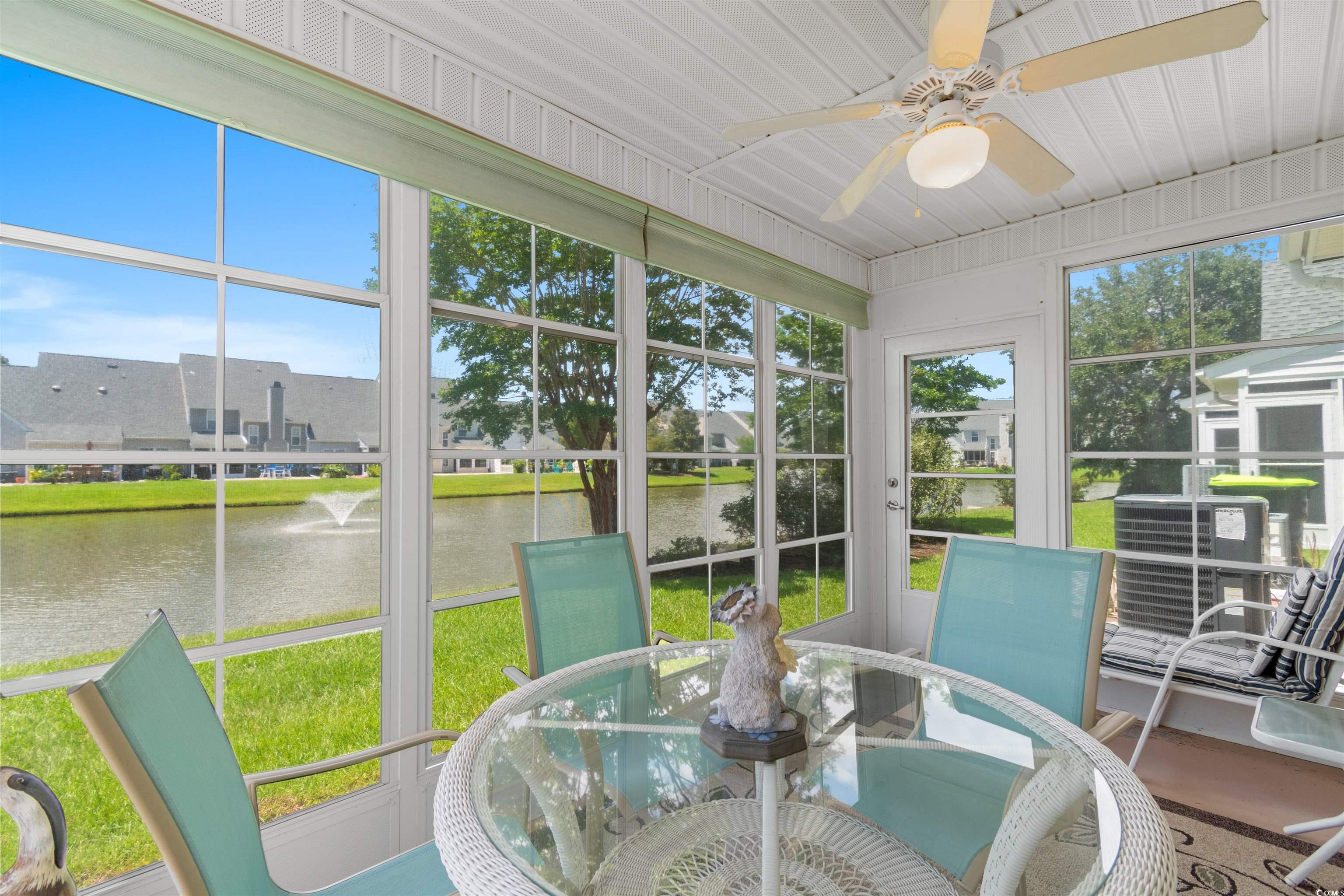 155 Wimbledon Way, Unit 155 Murrells Inlet, SC 29576 - Photo 13 of 32 Living room with a high ceiling, light hardwood /