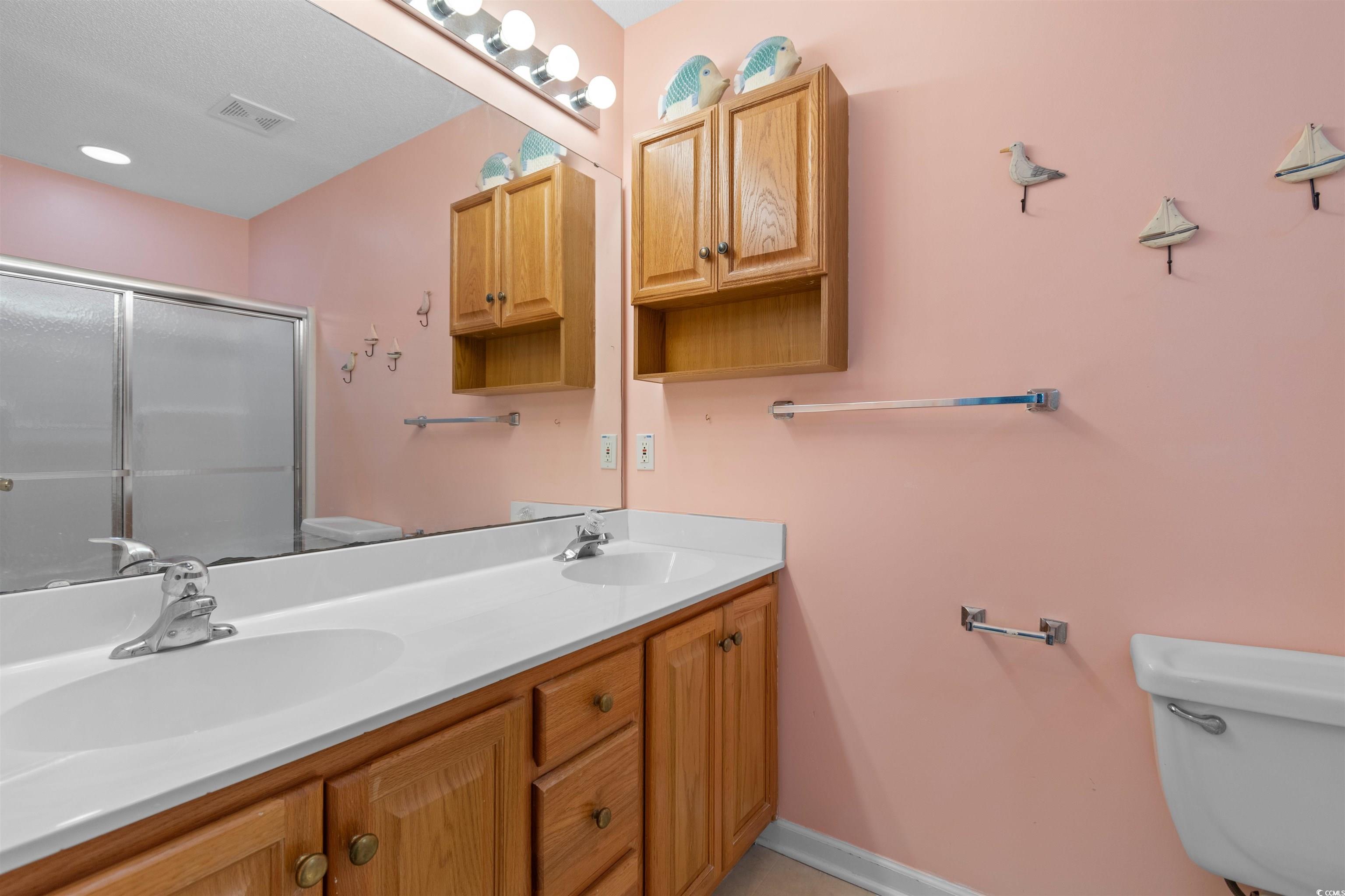 155 Wimbledon Way, Unit 155 Murrells Inlet, SC 29576 - Photo 15 of 32 Bedroom featuring high vaulted ceiling, a closet,
