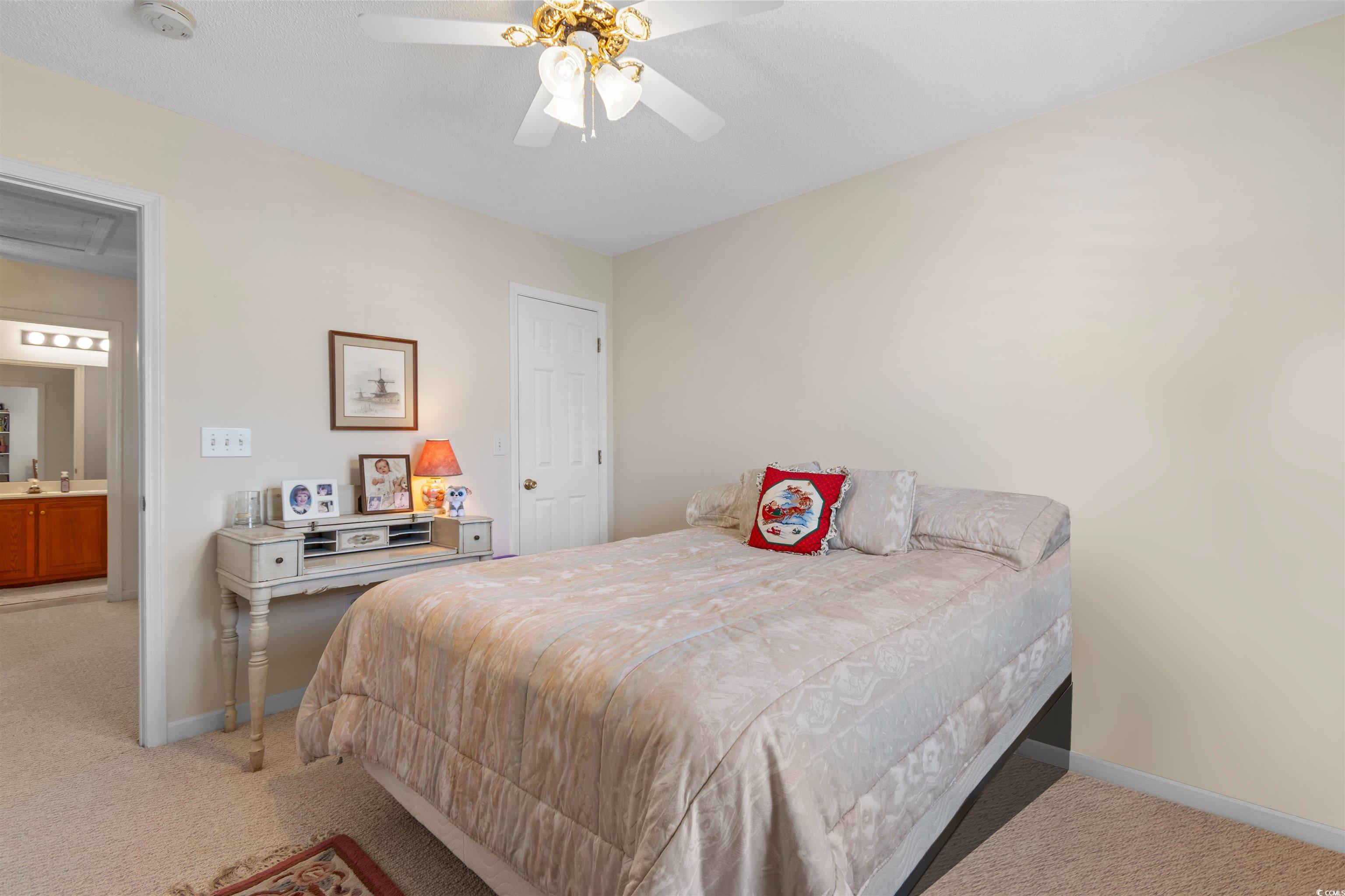 155 Wimbledon Way, Unit 155 Murrells Inlet, SC 29576 - Photo 20 of 32 Carpeted bedroom with a textured ceiling and ceili