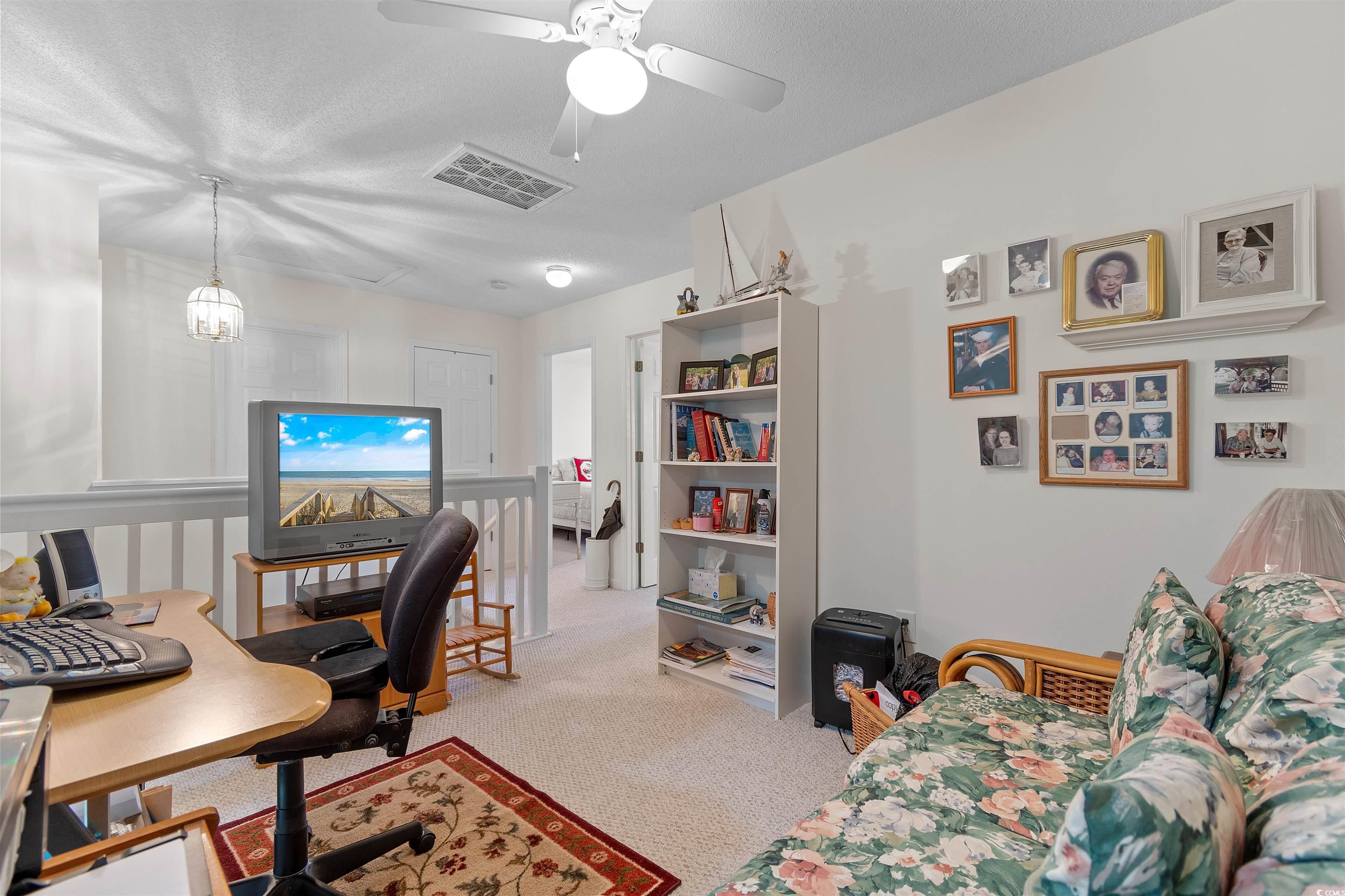 155 Wimbledon Way, Unit 155 Murrells Inlet, SC 29576 - Photo 21 of 32 Bedroom featuring a closet, carpet floors, and cei