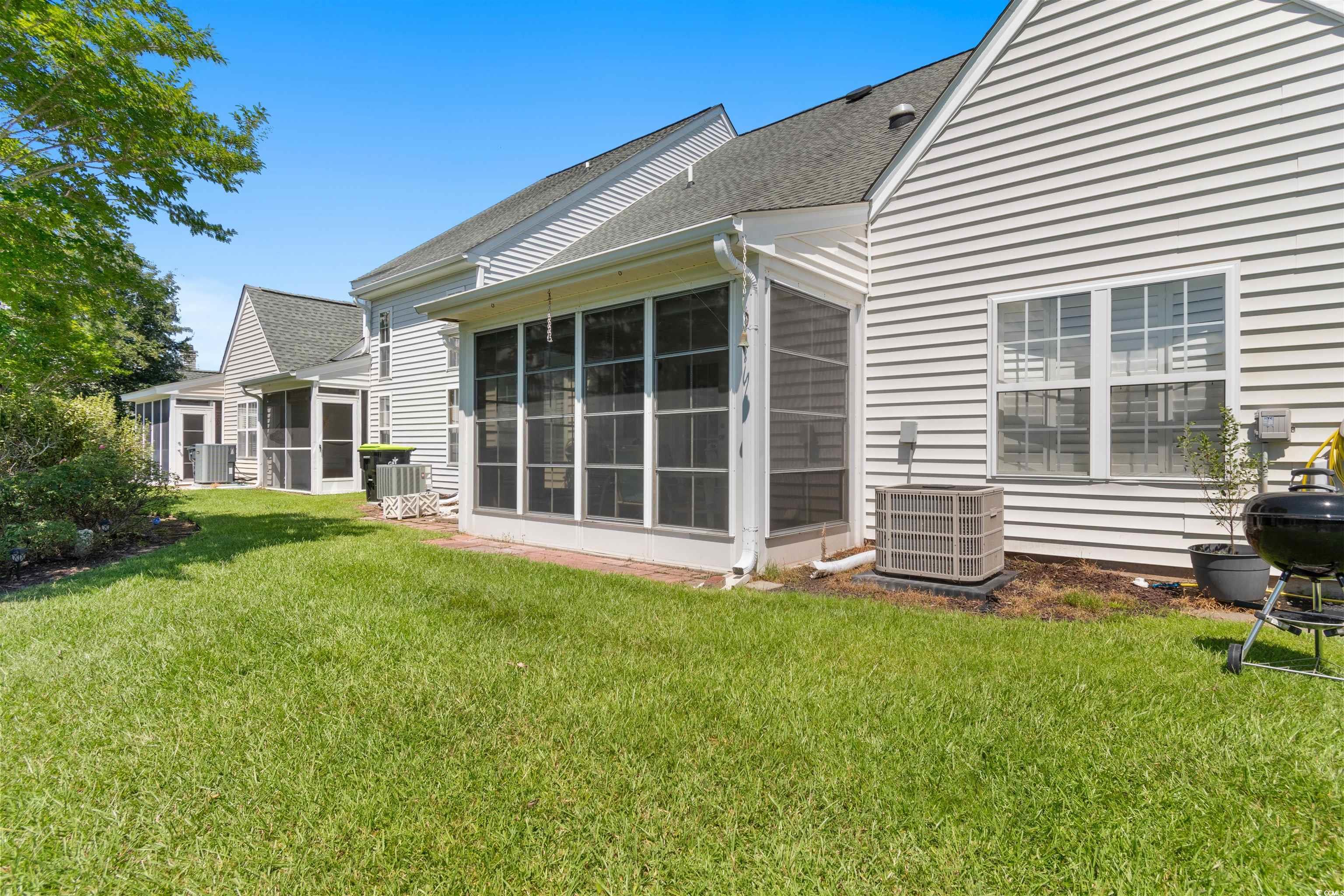 155 Wimbledon Way, Unit 155 Murrells Inlet, SC 29576 - Photo 23 of 32 Bedroom with light carpet and ceiling fan