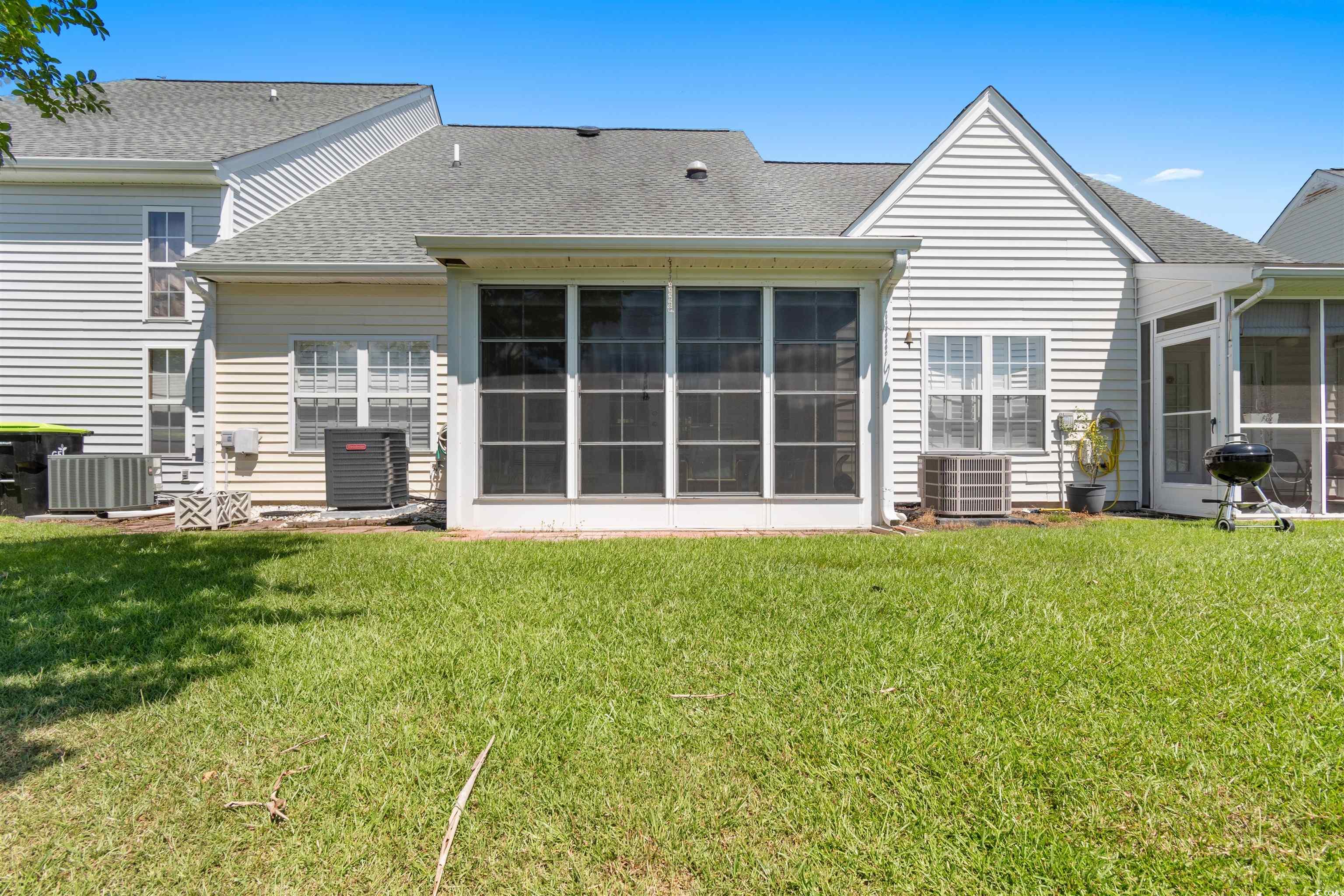 155 Wimbledon Way, Unit 155 Murrells Inlet, SC 29576 - Photo 24 of 32 Bedroom with light carpet, ensuite bathroom, sink,