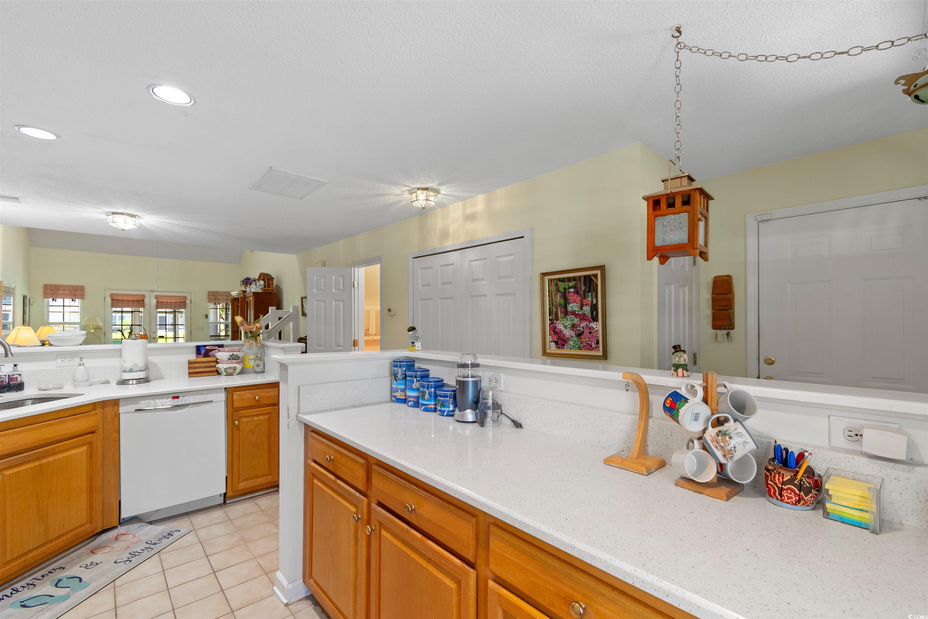 155 Wimbledon Way, Unit 155 Murrells Inlet, SC 29576 - Photo 6 of 32 Kitchen with sink, light tile patterned flooring,