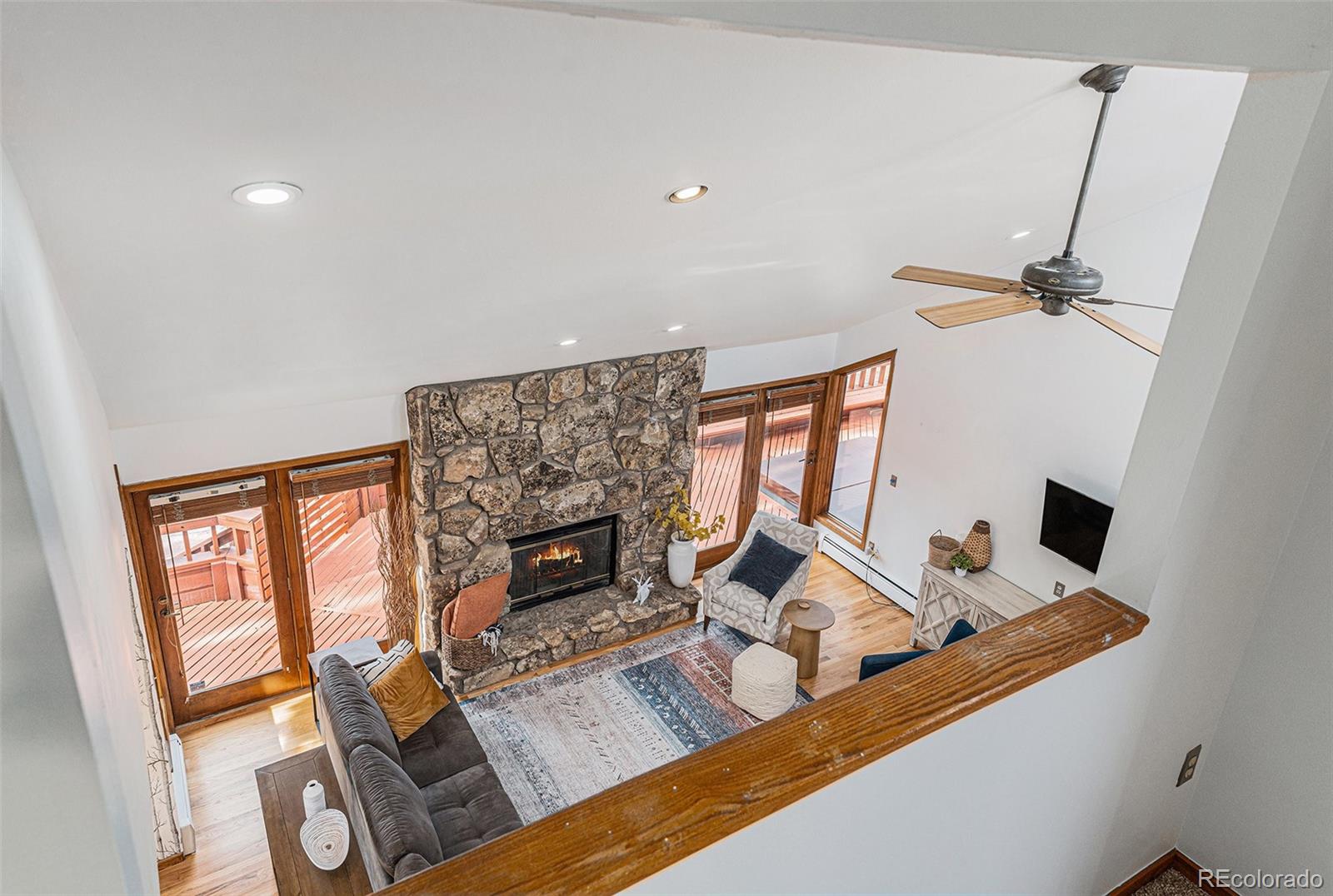 23526 Currant Drive Golden, CO 80401 - Photo 19 of 30 a living room with furniture and a fireplace