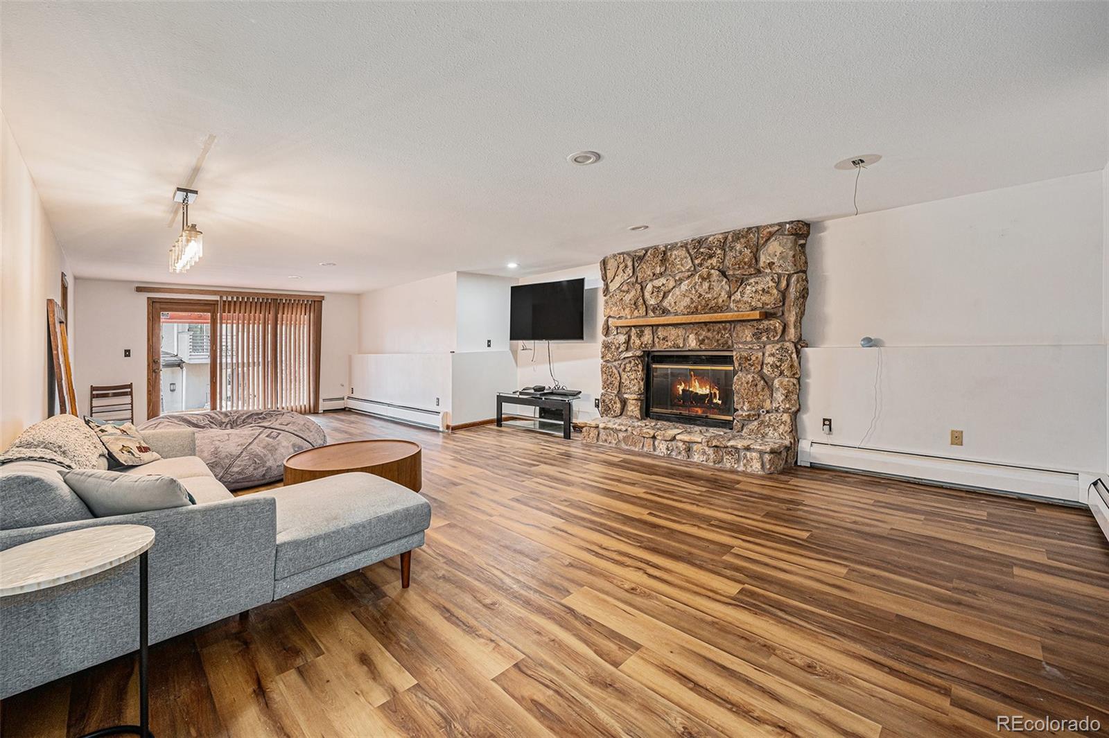 23526 Currant Drive Golden, CO 80401 - Photo 20 of 30 a living room with furniture and a fireplace