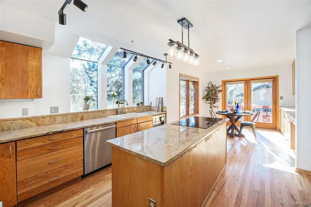 a very nice looking kitchen with a large window
