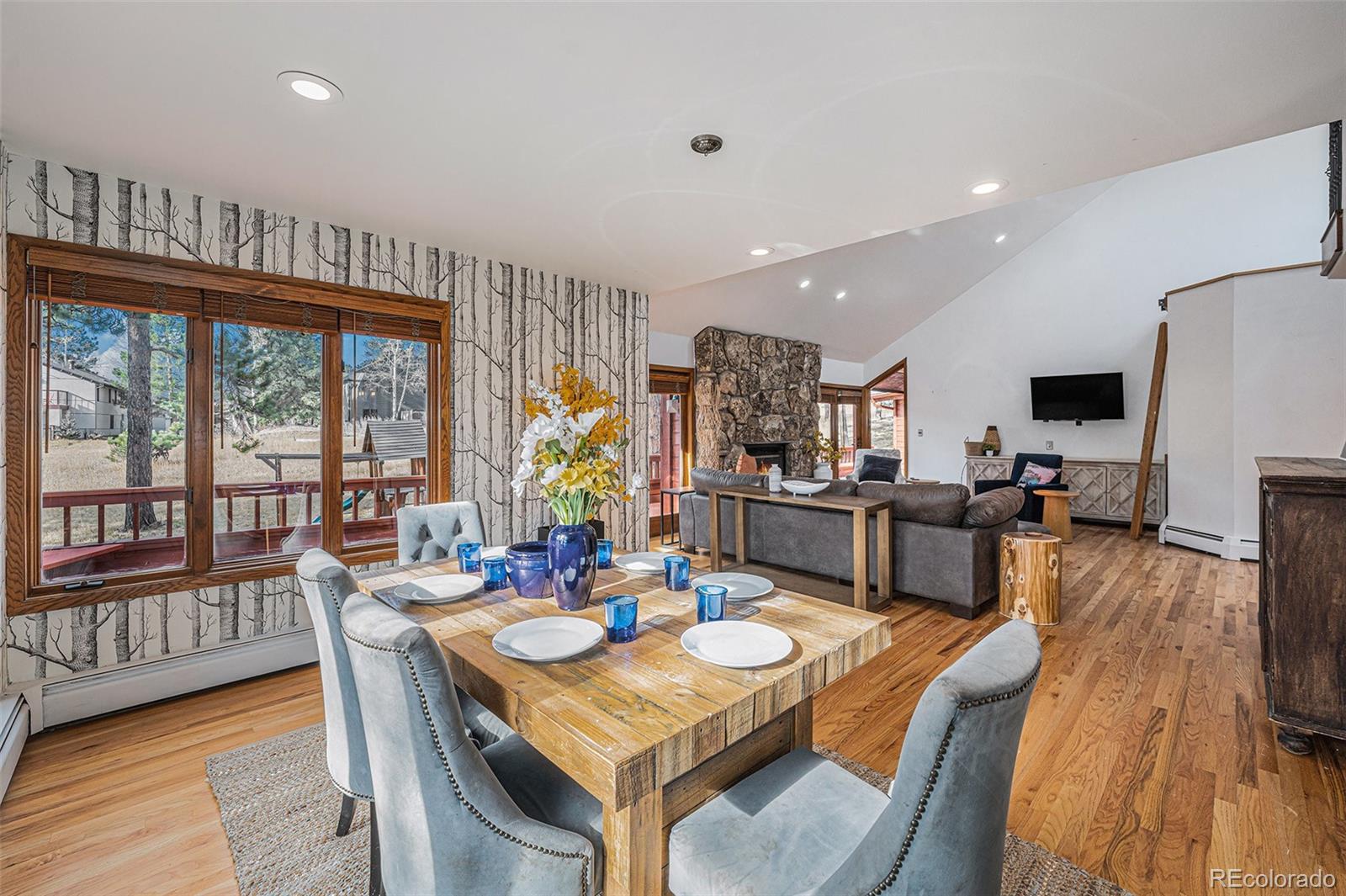 23526 Currant Drive Golden, CO 80401 - Photo 10 of 30 a view of a dining room with furniture window and wooden floor