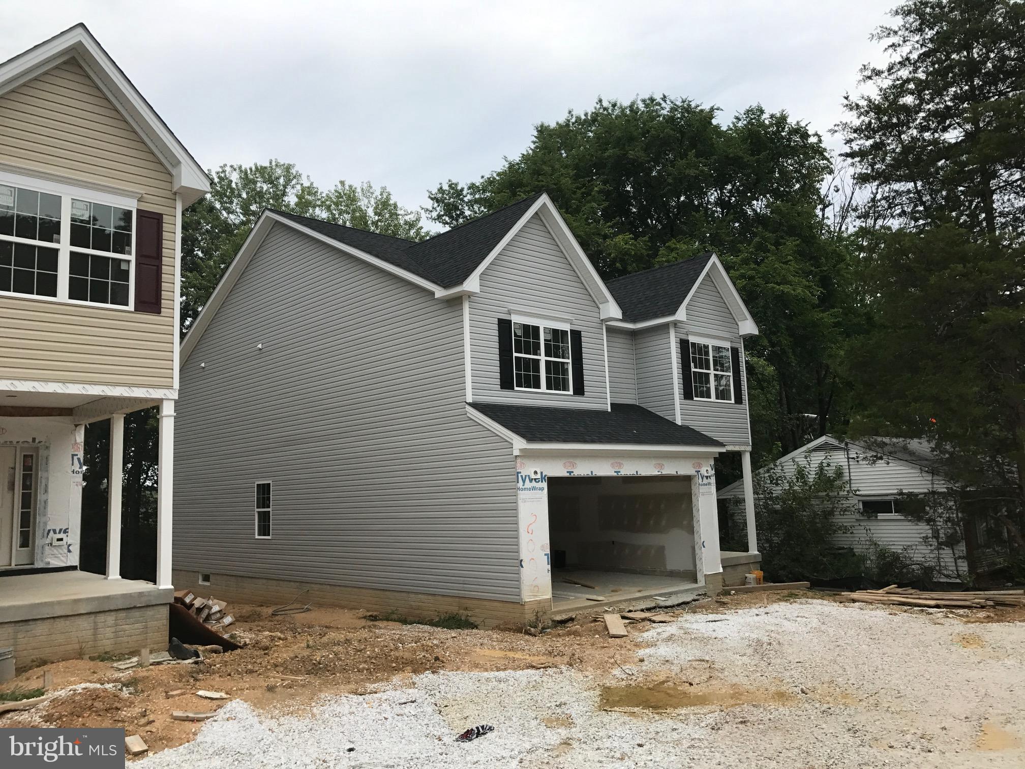 8006 Hillendale Road Parkville, MD 21234 - Photo 1 of 16 a front view of a house with a yard