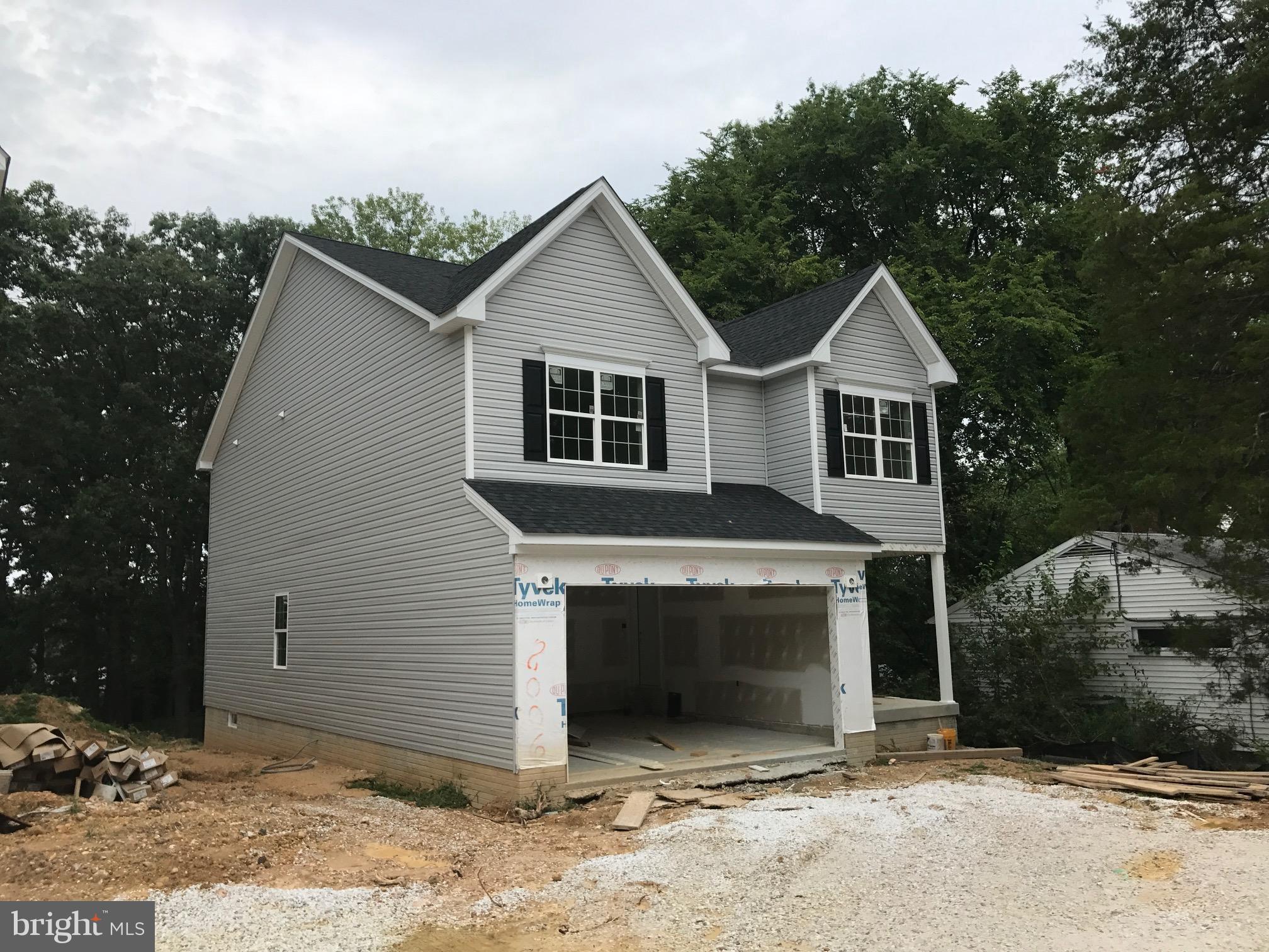 8006 Hillendale Road Parkville, MD 21234 - Photo 2 of 16 a view of a house with a yard and garage
