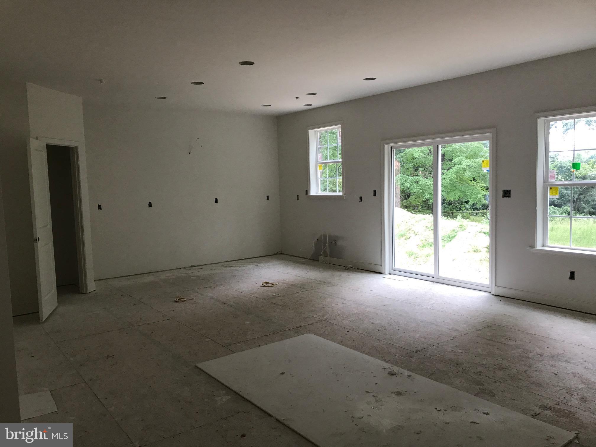 8006 Hillendale Road Parkville, MD 21234 - Photo 7 of 16 a view of a livingroom with an empty space and a window