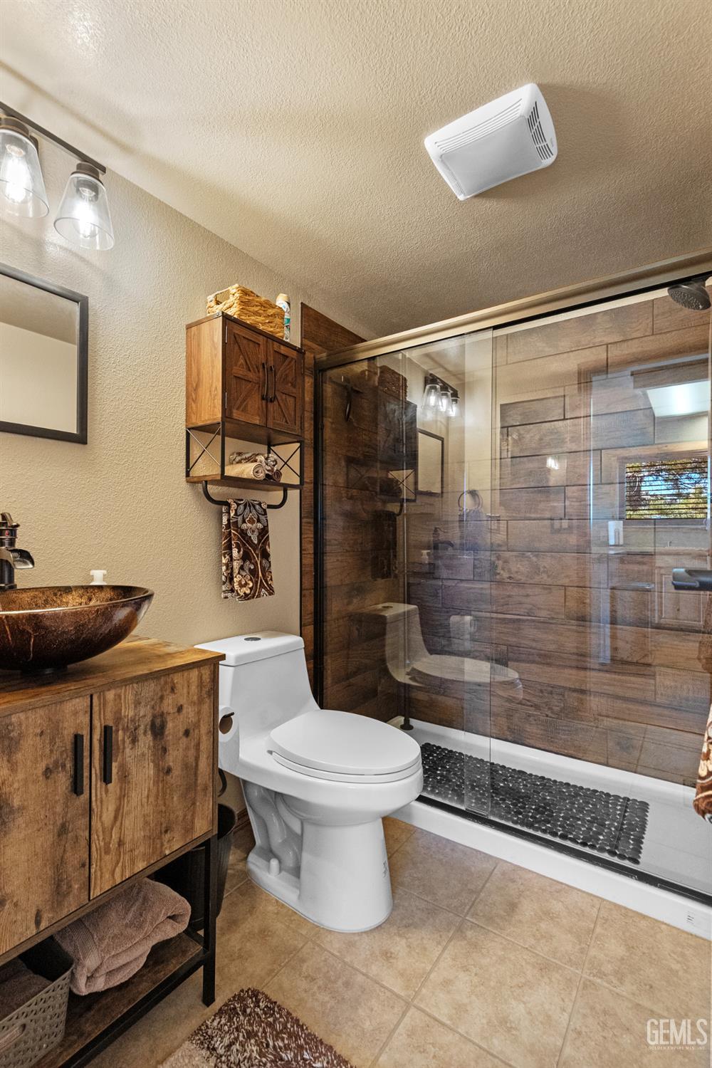 Undisclosed Address Tehachapi, CA 93561 - Photo 11 of 42 a bathroom with a toilet and a shower