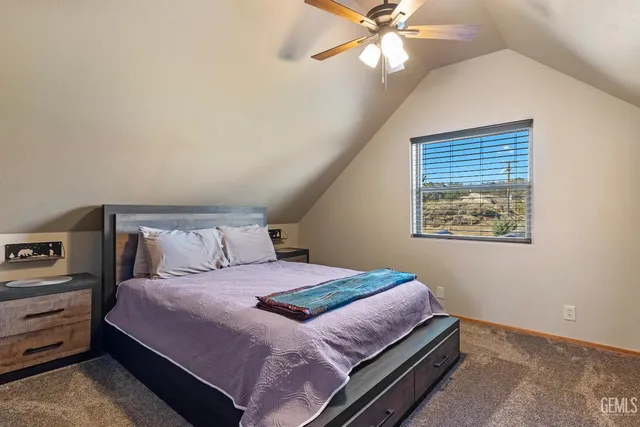 a view of a balcony with wooden floor and fence