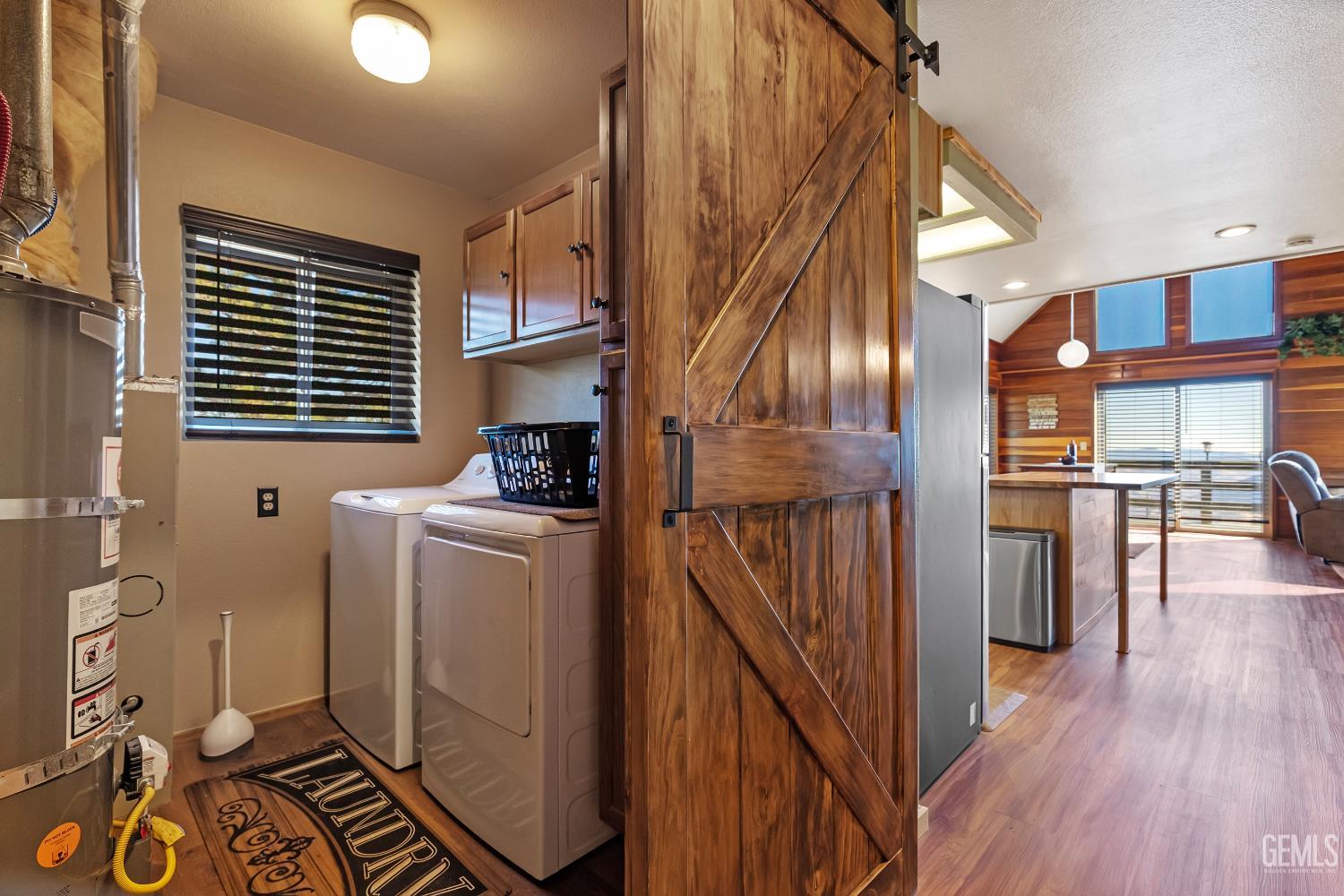 Undisclosed Address Tehachapi, CA 93561 - Photo 19 of 42 a kitchen with a refrigerator and wooden floor