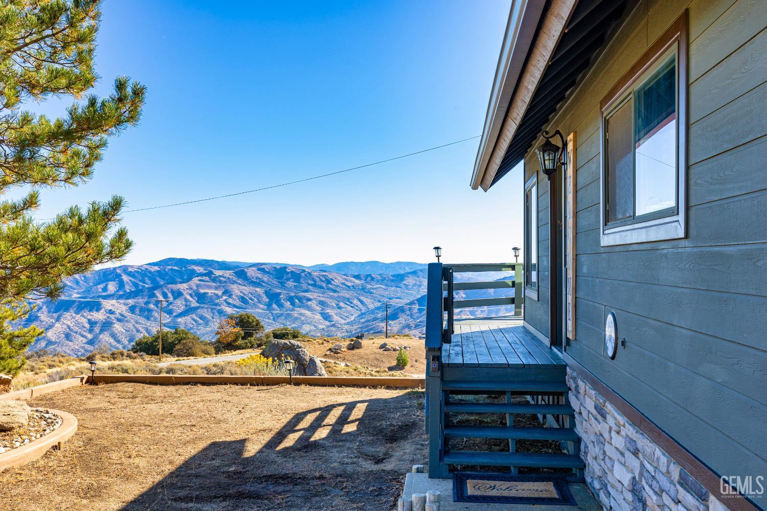 Undisclosed Address Tehachapi, CA 93561 - Photo 21 of 42 a view of a balcony with wooden floor and fence