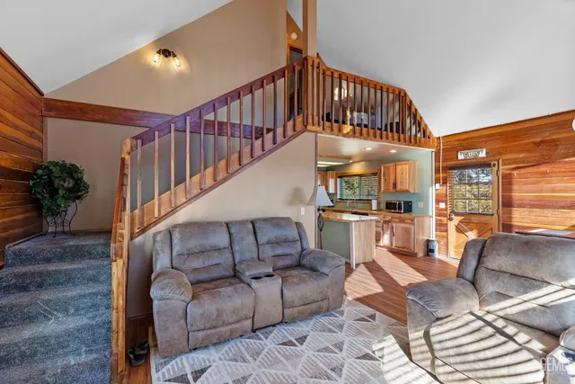 a bedroom with a bed and a mirror on the dresser