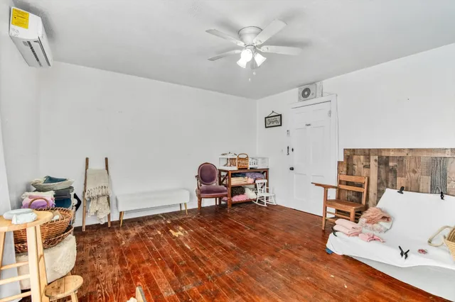 a view of a house with a sink and wooden floor