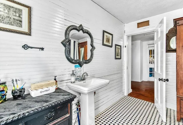 a living room with furniture windows and a flat screen tv