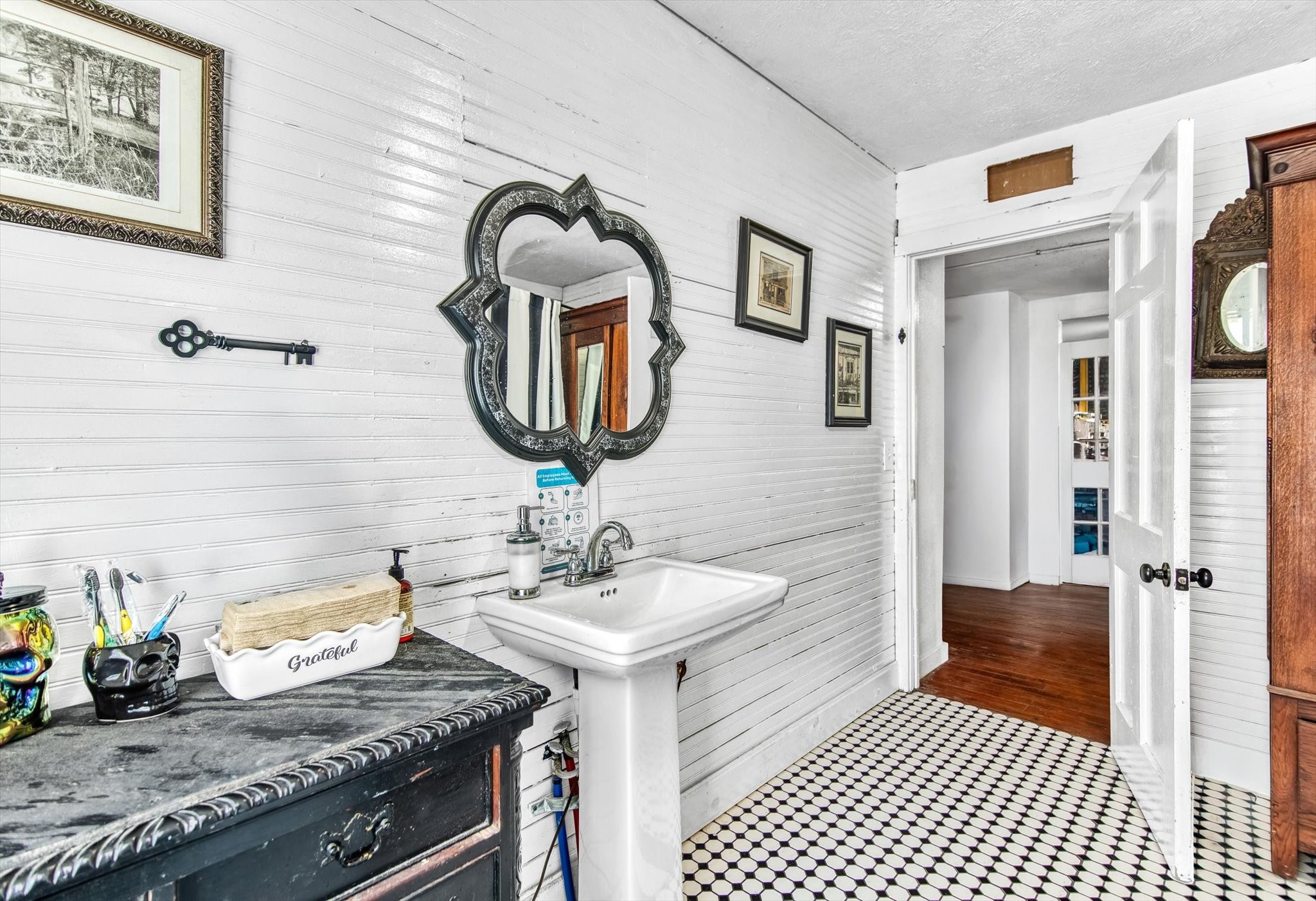 411 Willcox Street Anahuac, TX 77514 - Photo 29 of 50 a bathroom with a sink and a mirror