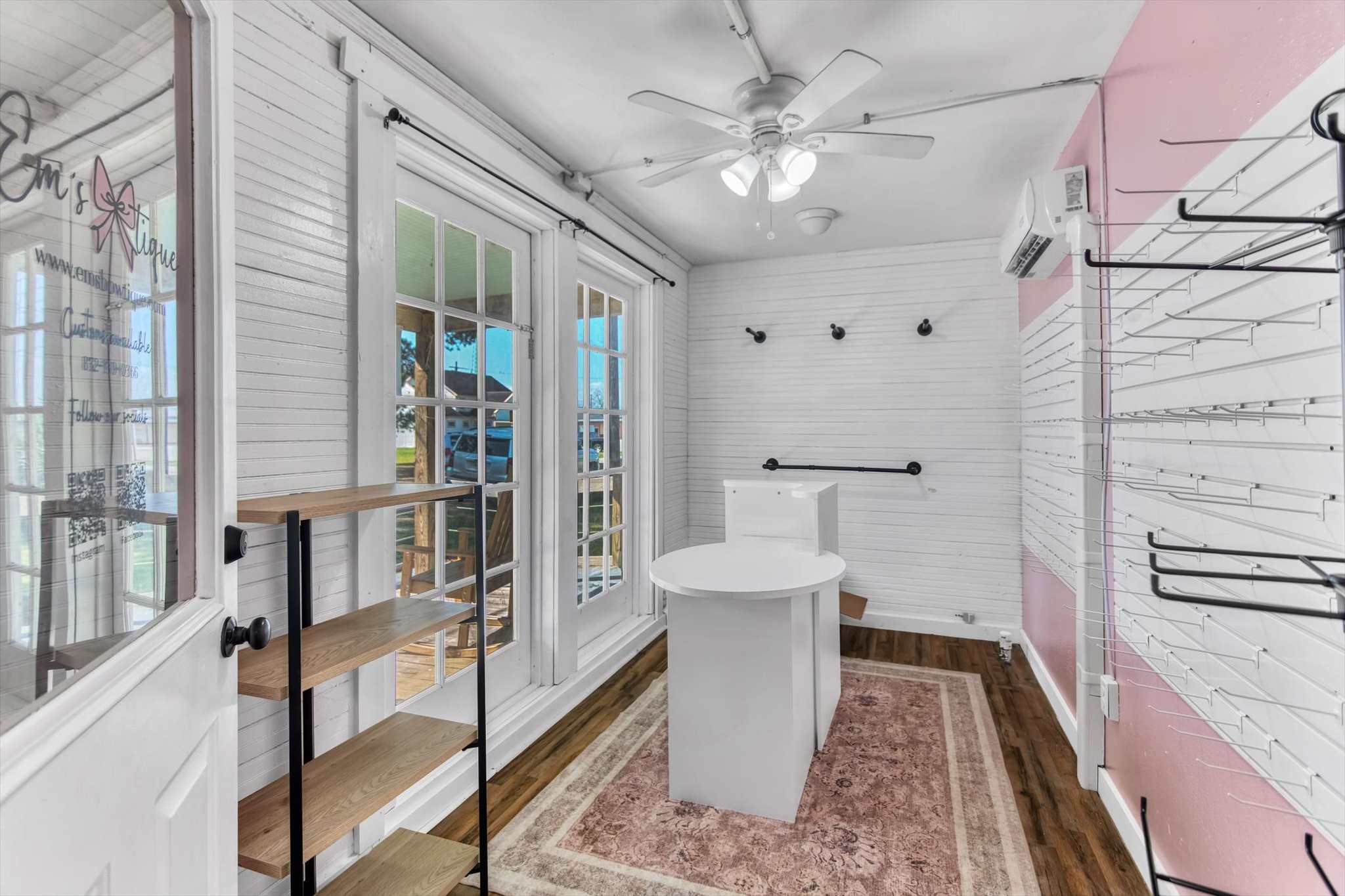 411 Willcox Street Anahuac, TX 77514 - Photo 30 of 50 a spacious bathroom with a white tub shower and a couch