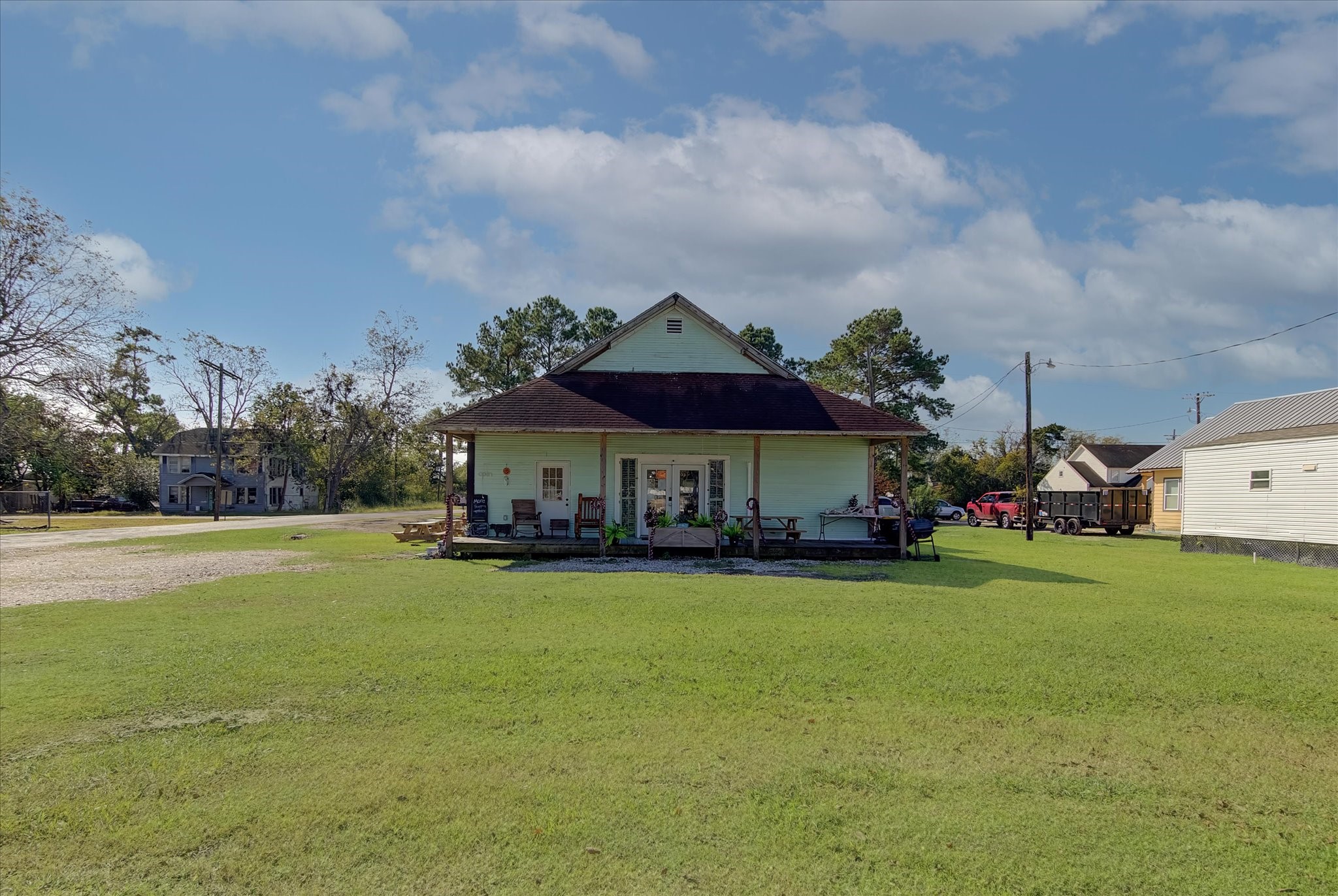 411 Willcox Street Anahuac, TX 77514 - Photo 36 of 50 a view of a house with garden and a yard