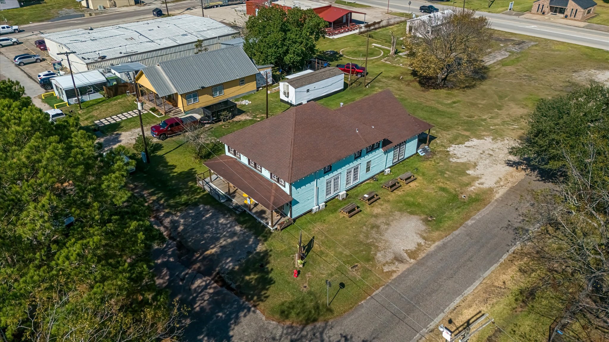 411 Willcox Street Anahuac, TX 77514 - Photo 39 of 50 an aerial view of a house with a garden