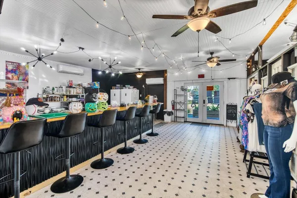 a living room with lots of furniture and a chandelier
