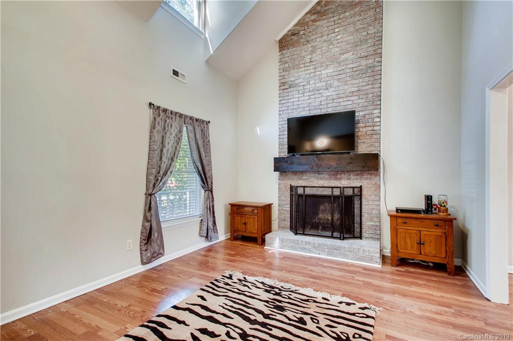 503 Southland Road Huntersville, NC 28078 - Photo 2 of 26 a living room with furniture and a fireplace