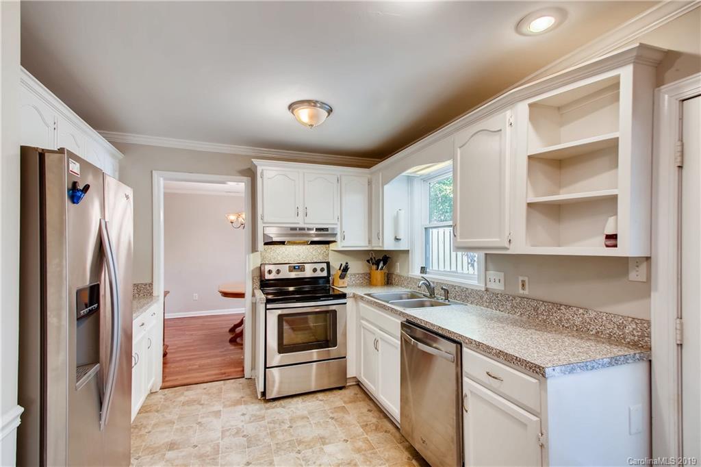 503 Southland Road Huntersville, NC 28078 - Photo 12 of 26 a kitchen with stainless steel appliances granite countertop a stove a sink and a refrigerator