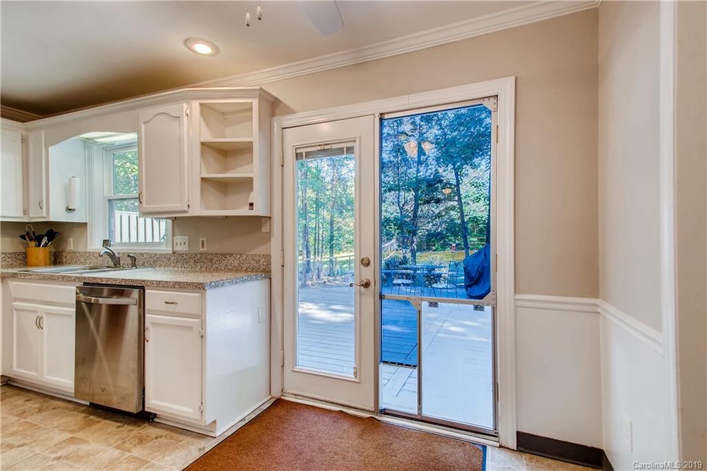 503 Southland Road Huntersville, NC 28078 - Photo 13 of 26 a kitchen with a stove a sink and a refrigerator
