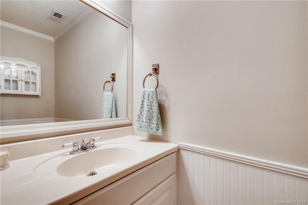 503 Southland Road Huntersville, NC 28078 - Photo 15 of 26 a bathroom with a sink and a mirror