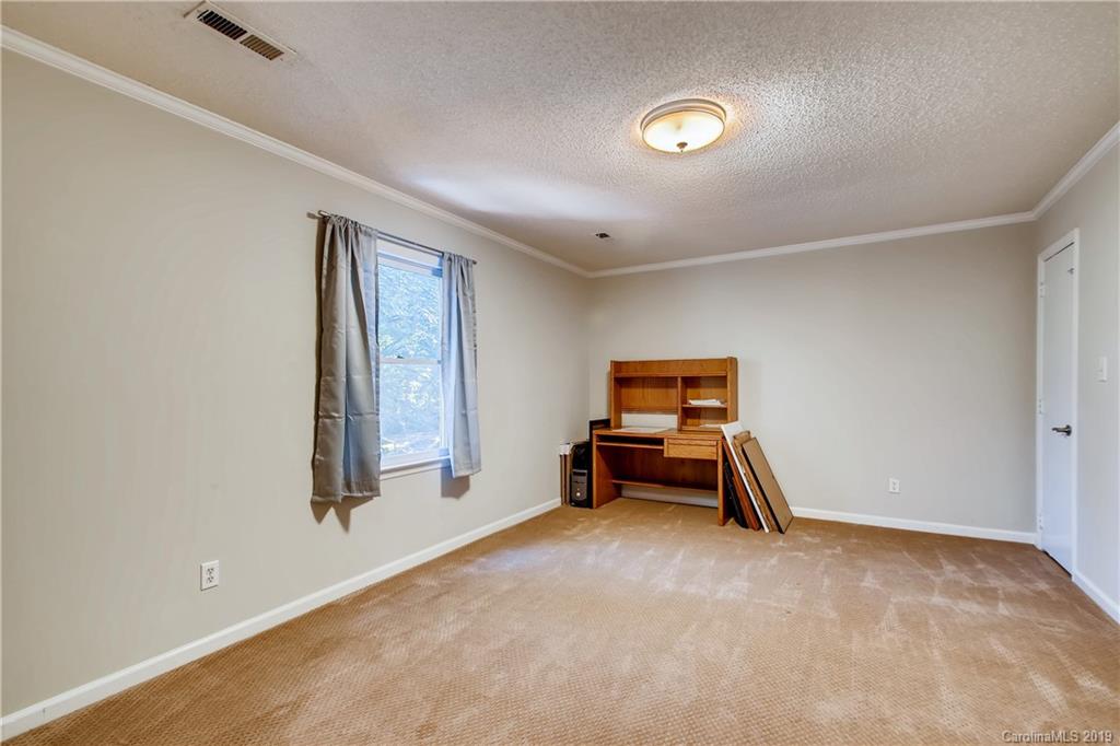 503 Southland Road Huntersville, NC 28078 - Photo 16 of 26 a bedroom with furniture and window