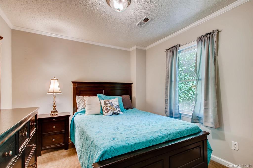 503 Southland Road Huntersville, NC 28078 - Photo 17 of 26 a bedroom with a bed and a window