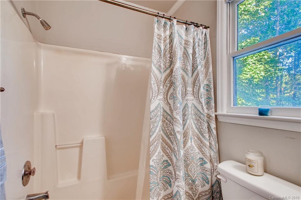 503 Southland Road Huntersville, NC 28078 - Photo 18 of 26 a bathroom with a shower curtain and a sink