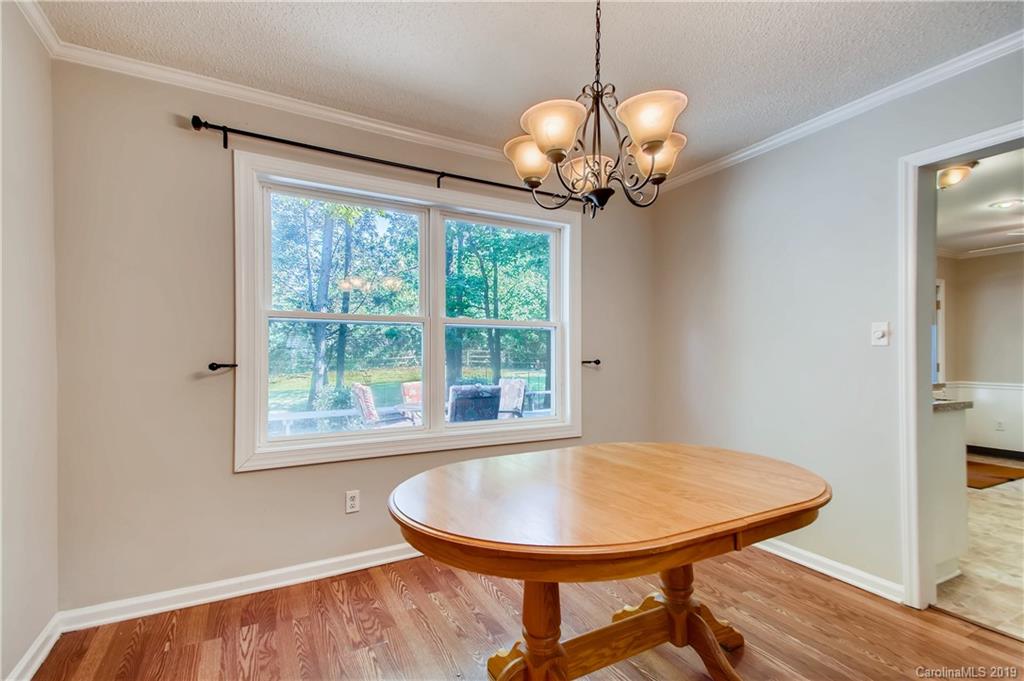 503 Southland Road Huntersville, NC 28078 - Photo 9 of 26 a view of a dining room with a table and chandelier