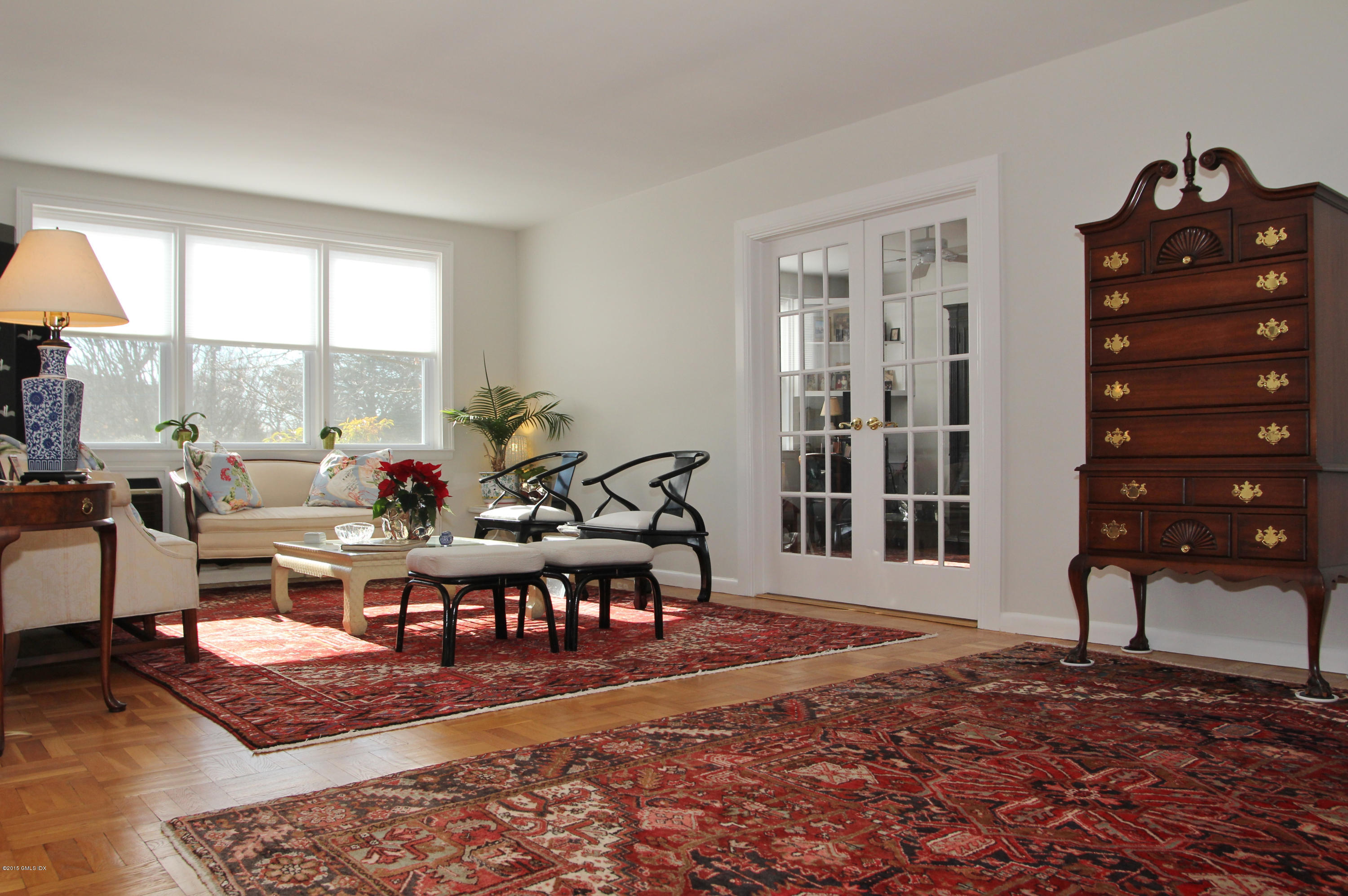 a living room with furniture a window and a rug