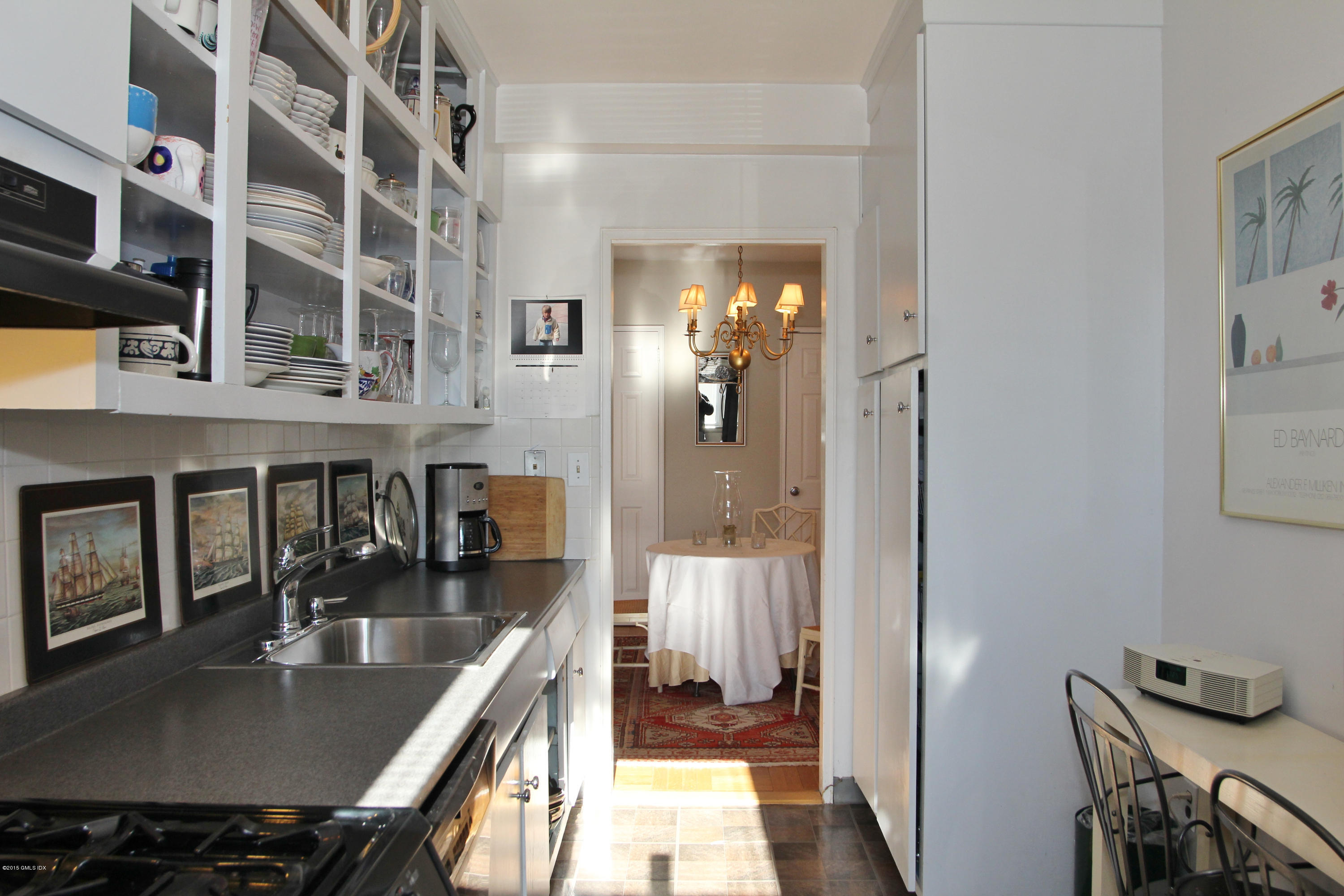 5 Putnam Hill, Unit 1F Greenwich, CT 06830 - Photo 12 of 18 a kitchen with a table and chairs