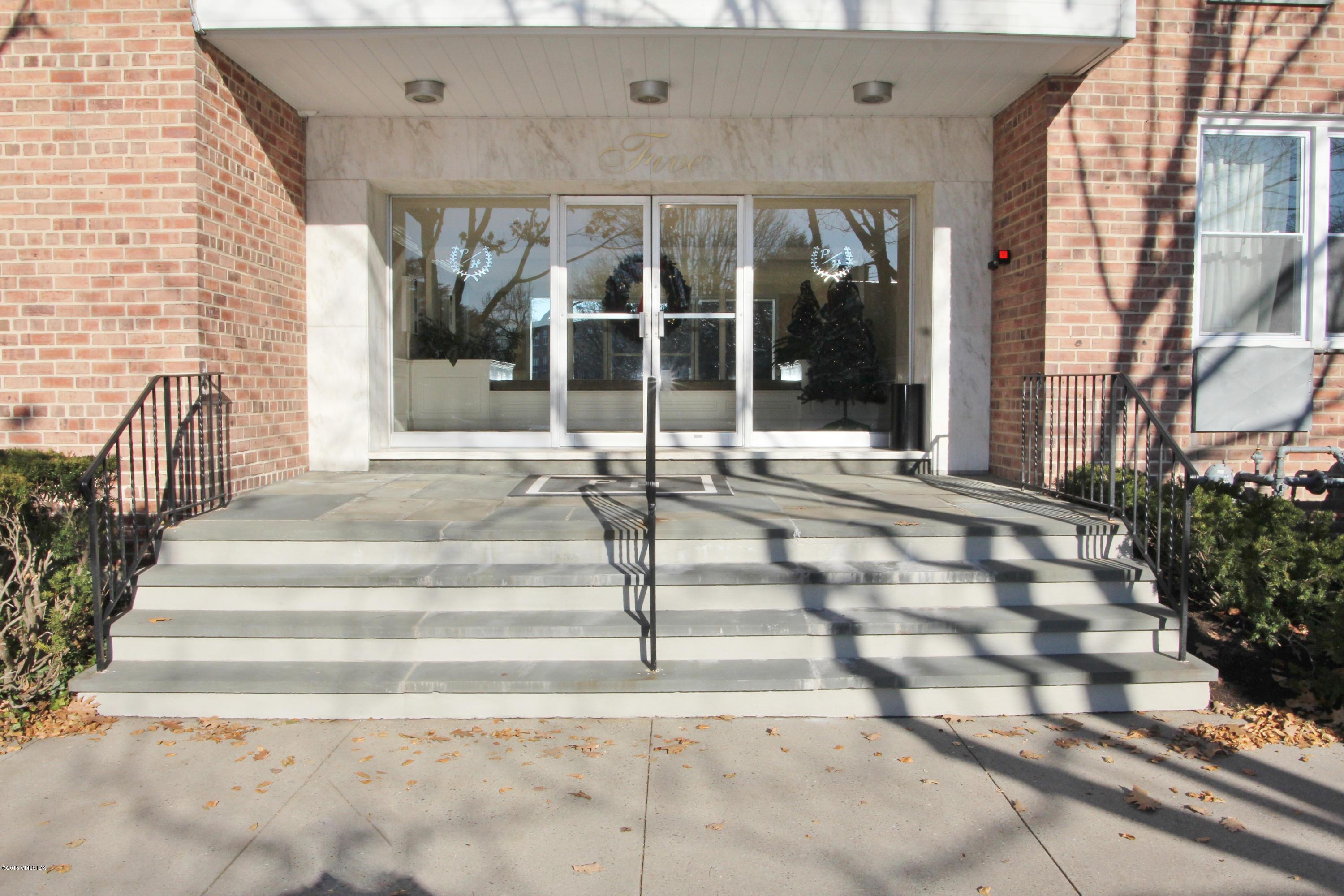 5 Putnam Hill, Unit 1F Greenwich, CT 06830 - Photo 16 of 18 a view of a house with a porch
