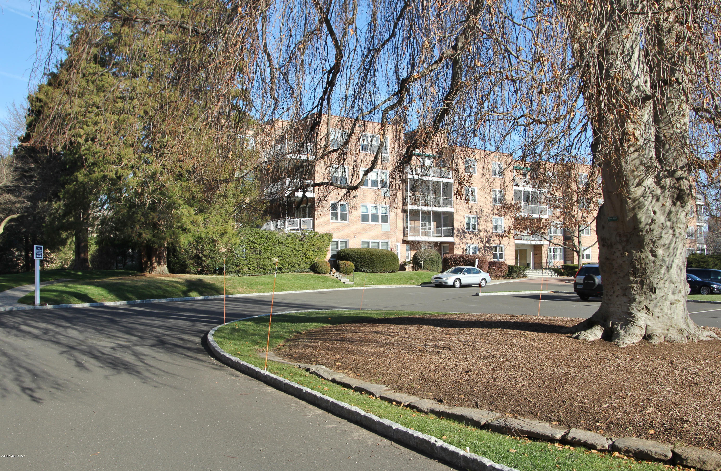 5 Putnam Hill, Unit 1F Greenwich, CT 06830 - Photo 18 of 18 a view of a park with large trees