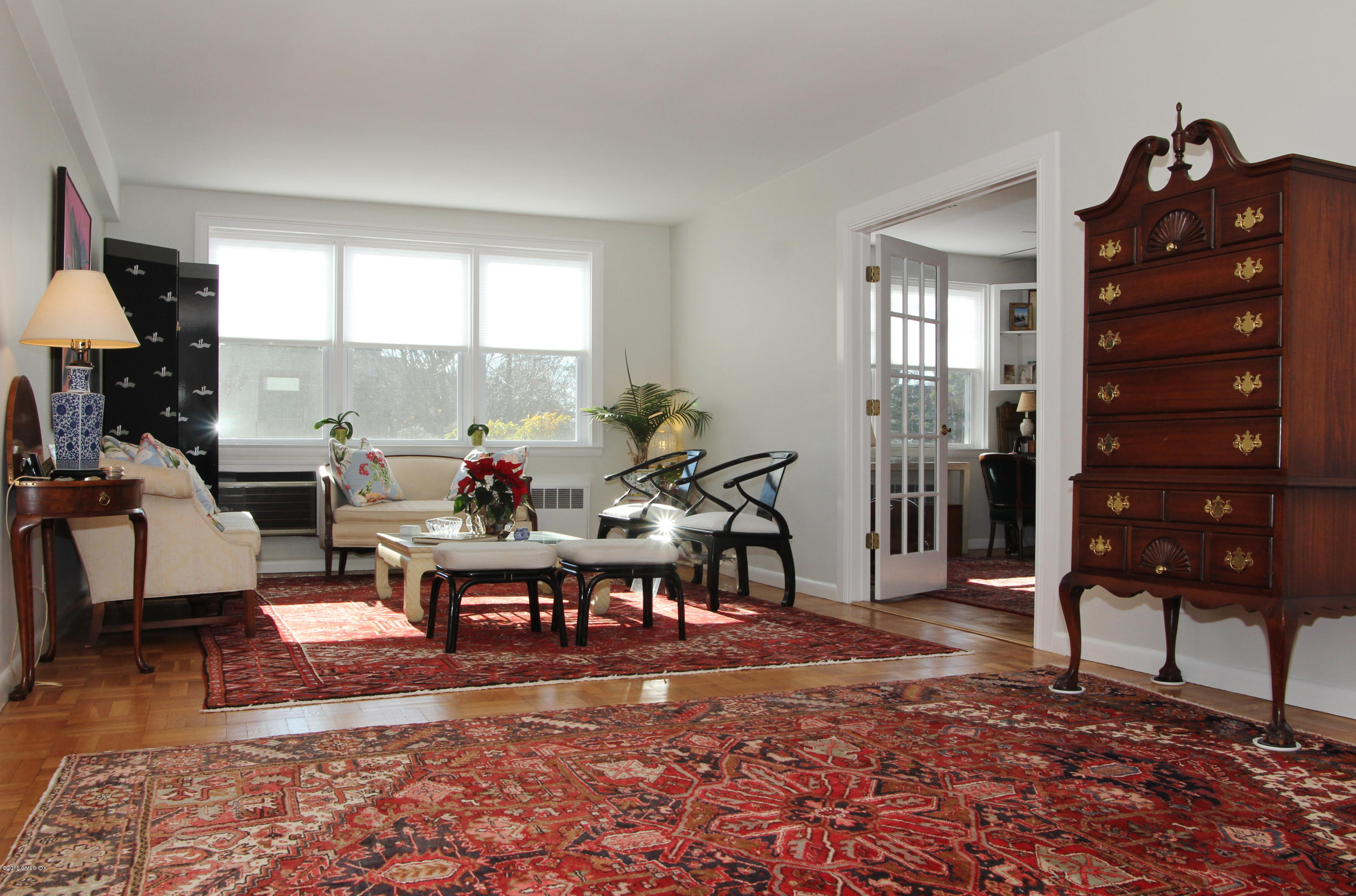 5 Putnam Hill, Unit 1F Greenwich, CT 06830 - Photo 8 of 18 a living room with furniture a rug and a window