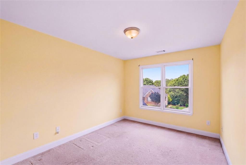 3420 Bulloch Lake Road Loganville, GA 30052 - Photo 47 of 57 an empty room with windows