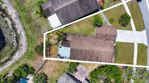 a view of a back yard from a balcony