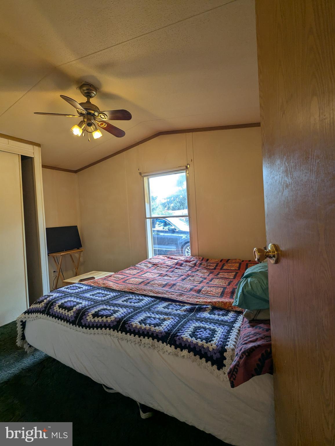 2525 Baltimore Boulevard Finksburg, MD 21048 - Photo 24 of 25 a bedroom with a bed and a chandelier