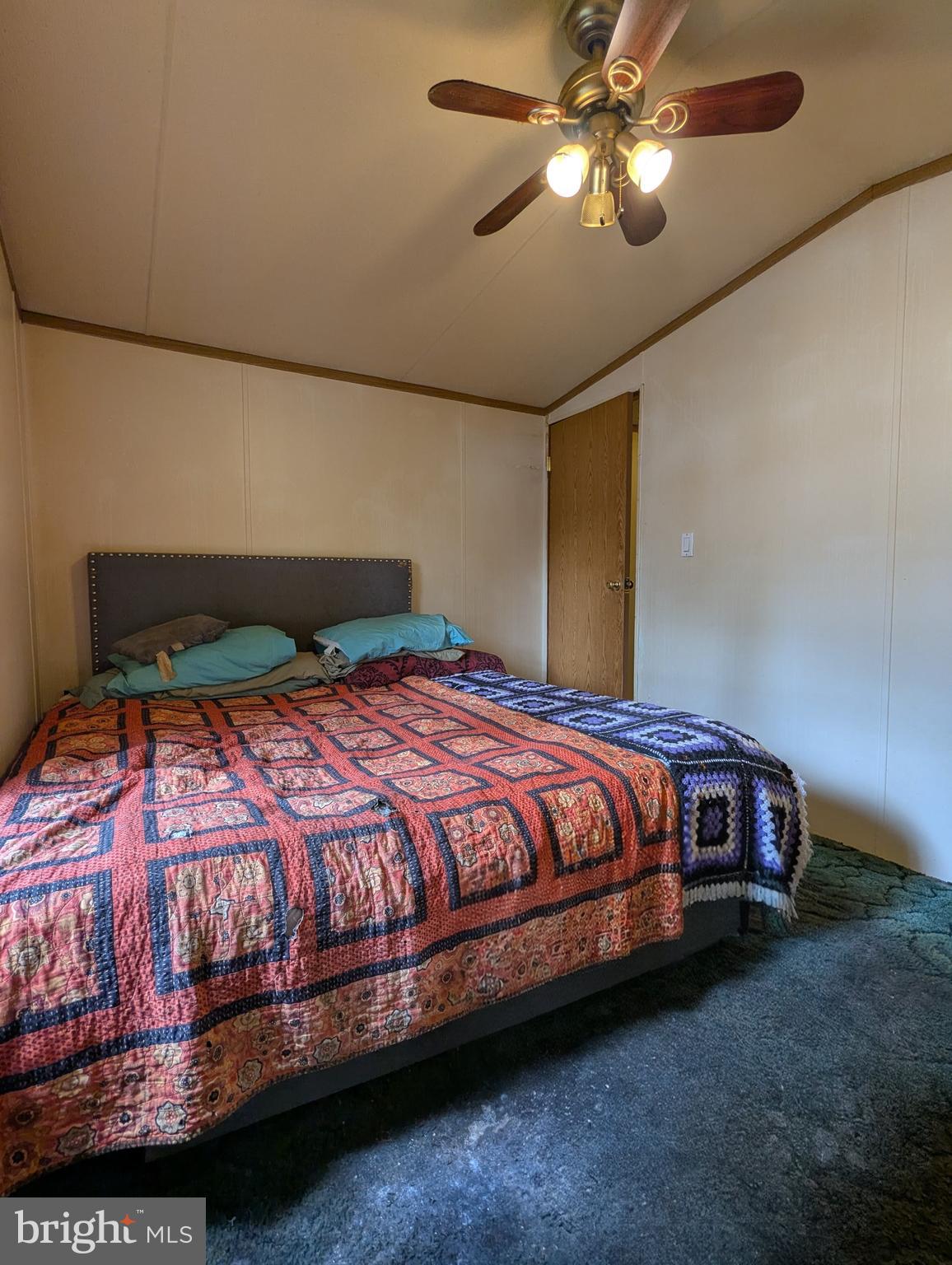 2525 Baltimore Boulevard Finksburg, MD 21048 - Photo 25 of 25 a bedroom with a bed and ceiling fan