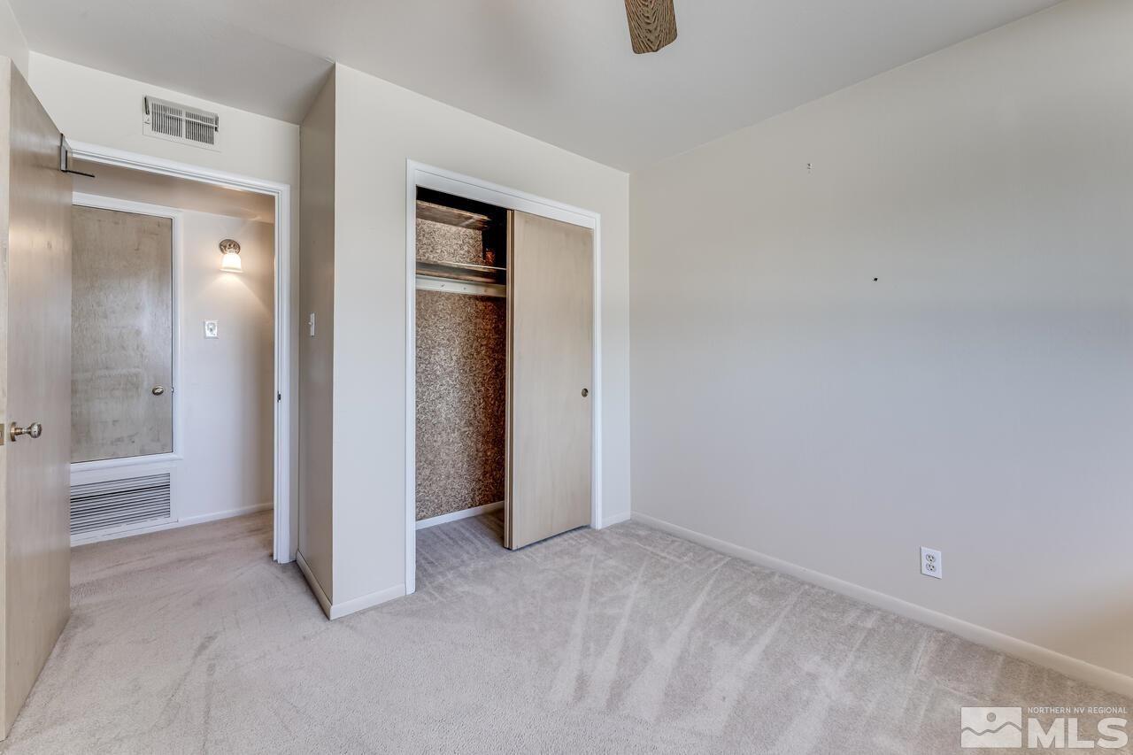 1935 Brisbane Avenue Reno, NV 89503 - Photo 21 of 38 an empty room with closet and windows