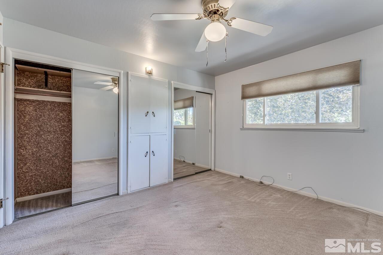 1935 Brisbane Avenue Reno, NV 89503 - Photo 25 of 38 an empty room with windows and closet