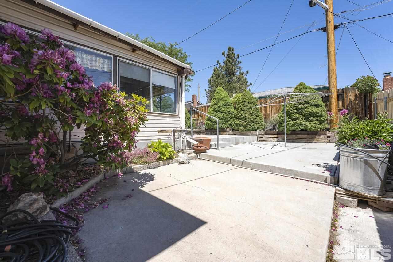 1935 Brisbane Avenue Reno, NV 89503 - Photo 36 of 38 a potted plant sitting in front of a house