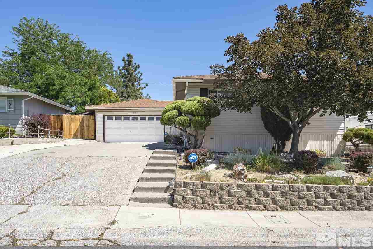 1935 Brisbane Avenue Reno, NV 89503 - Photo 5 of 38 a front view of a house with a yard and garage