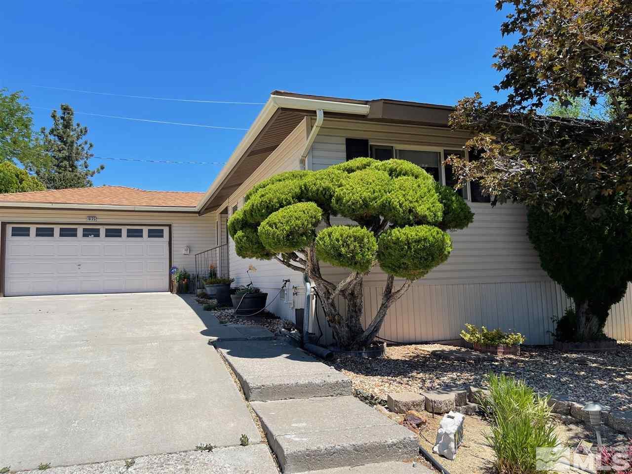 1935 Brisbane Avenue Reno, NV 89503 - Photo 6 of 38 a front view of a house with a yard