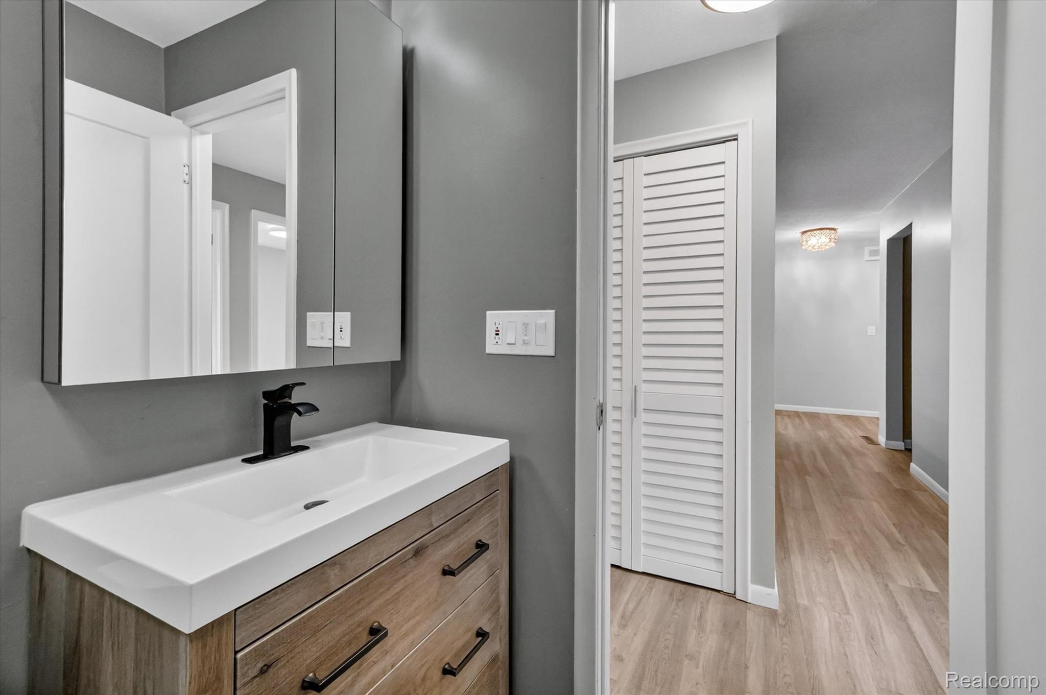 2264 Crane Road Fenton, MI 48430 - Photo 40 of 55 Bathroom with vanity and light wood-style floors