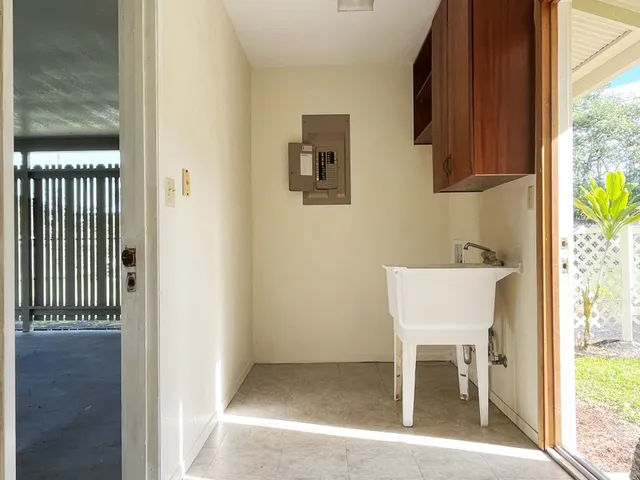 a view of a hallway with seating area